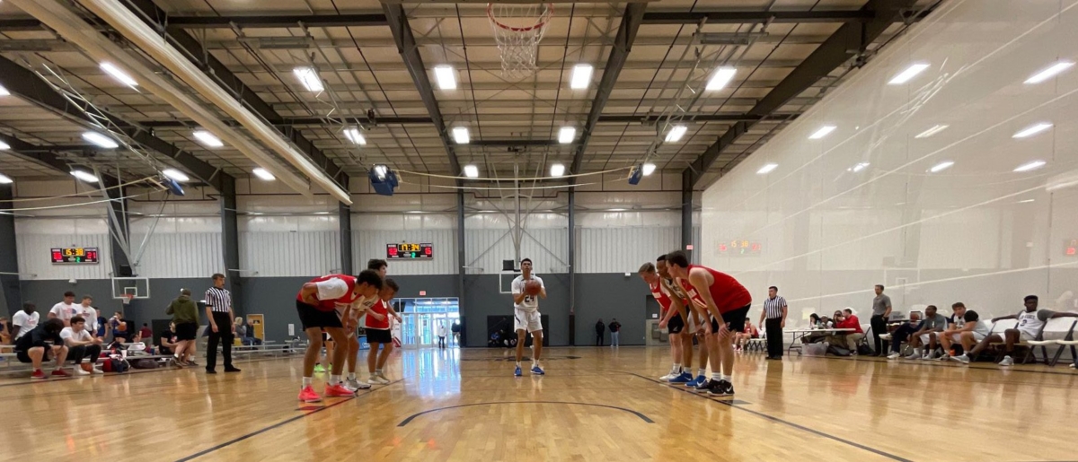 wide, straight on view of free throw taking place with players on each side